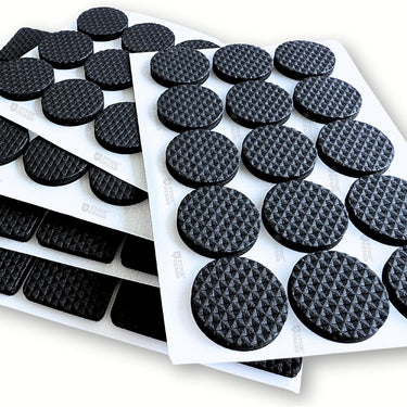 A sheet of non-slip furniture rubber pads arranged in rows, with some pads already adhered to a white surface.different shapes in one pack